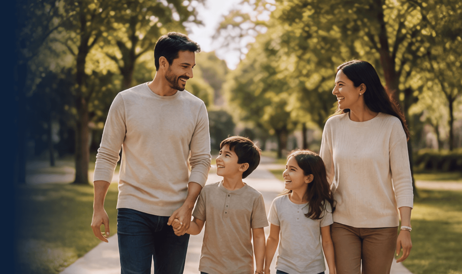 A family walking together on a tree-lined path