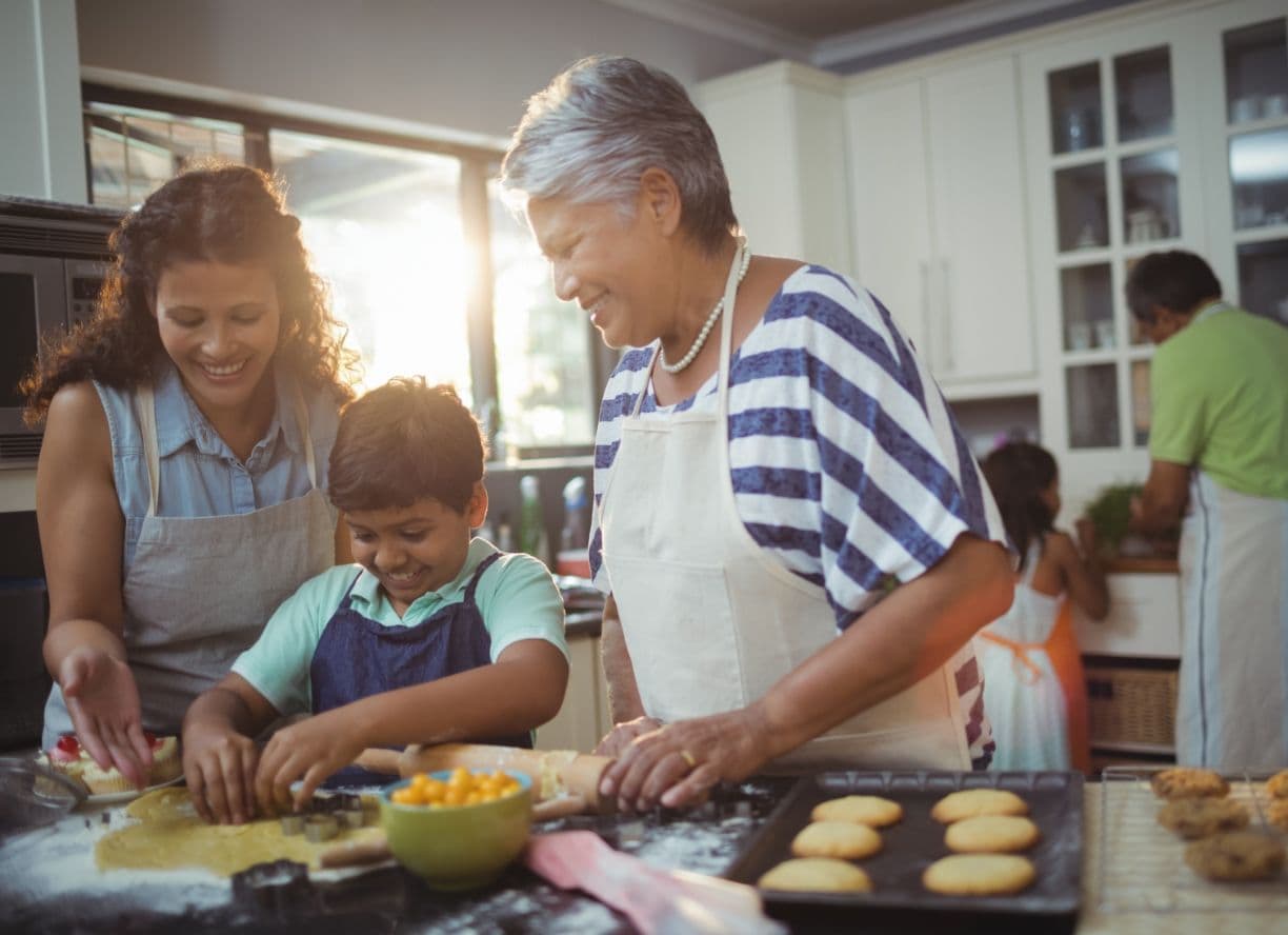 A family baking together in a kitchen